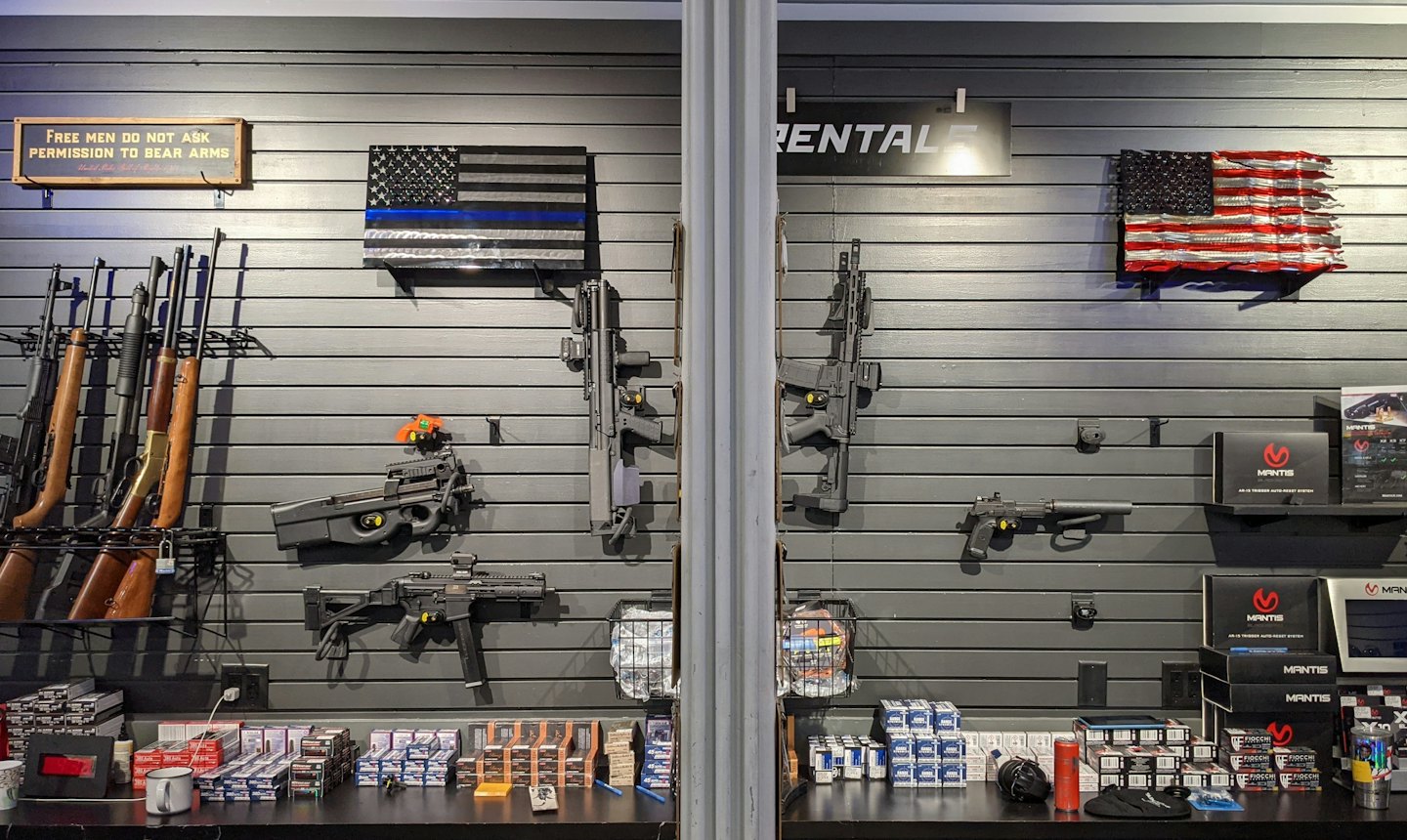 Guns and ammunition displayed in a brightly lit store.